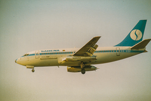 Classic airliner approaches landing at sunset