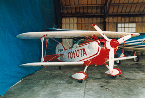 Vintage biplane showcased in a hangar space