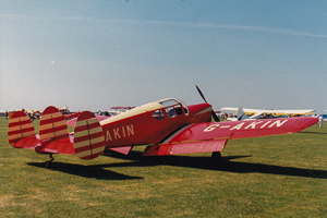 Vintage aircraft shines under the bright blue sky