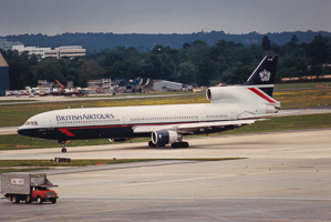 Classic aircraft taxiing on the runway at sunset