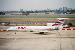 Colorful aircraft taxiing on a busy airport runway