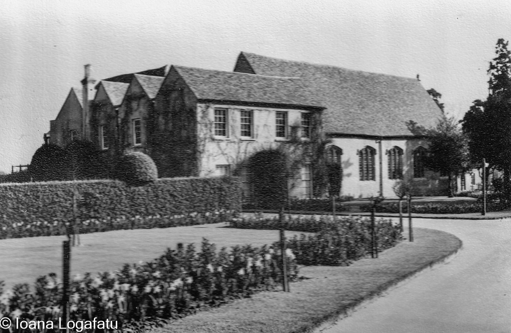 Historic building amid lush gardens