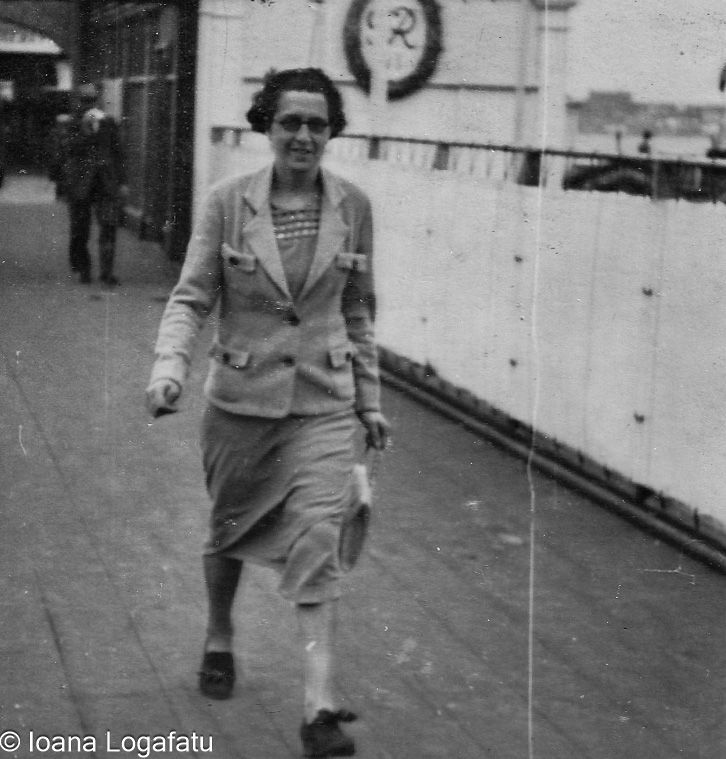 Woman strolls on coastal boardwalk
