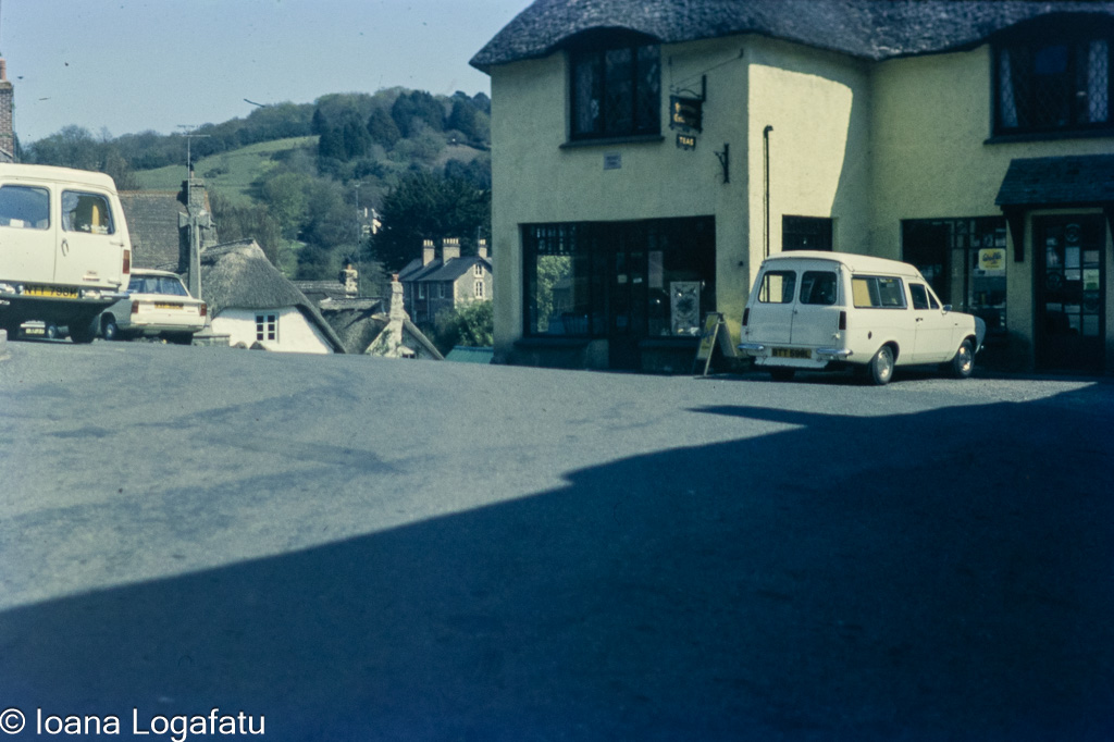 Vintage village corner with classic cars in view