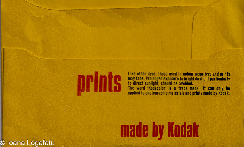 Bright yellow envelope containing color prints
