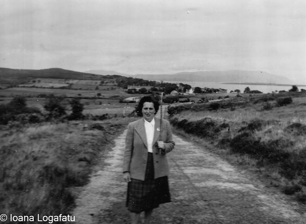 Woman walking along a country road in Ireland