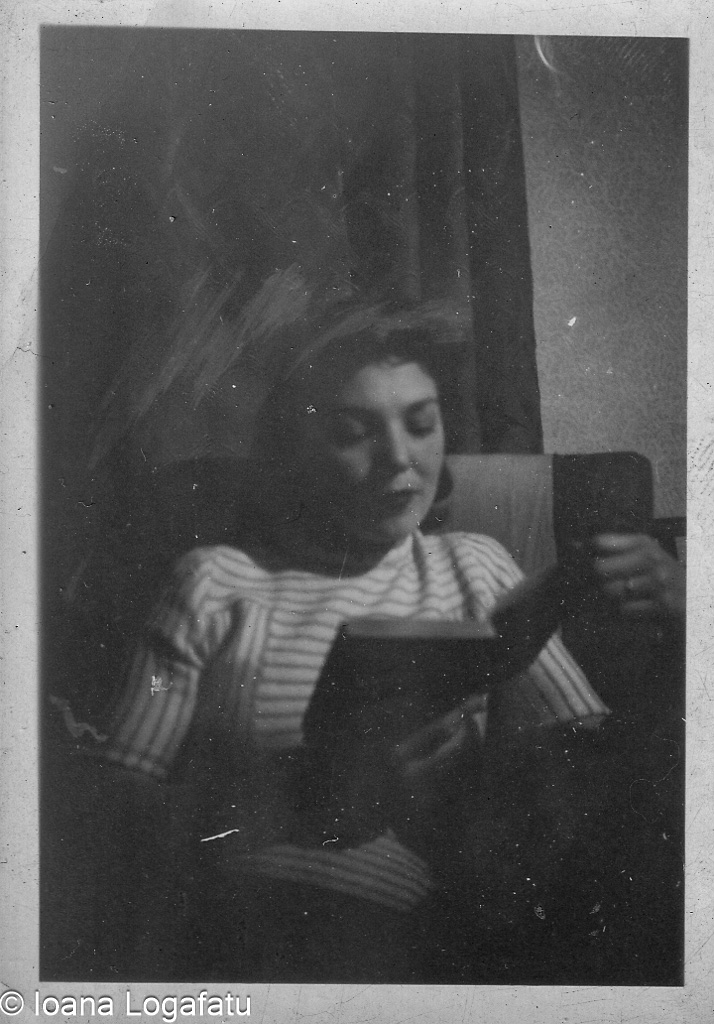 Woman reading a book in a cozy setting