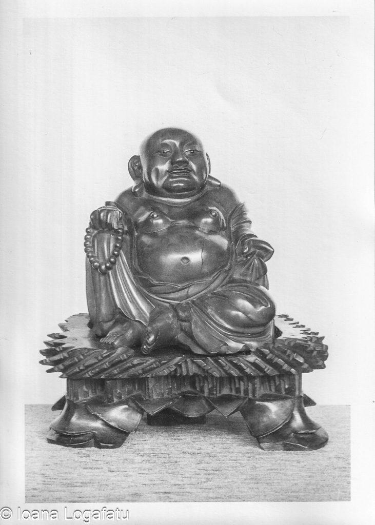Intricate carved wooden Buddha statue