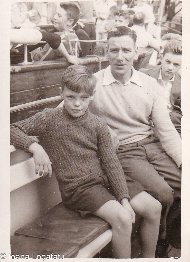 Father and son sharing a moment on a boat trip