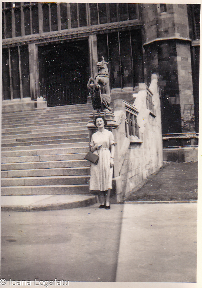 Woman standing near historic building steps