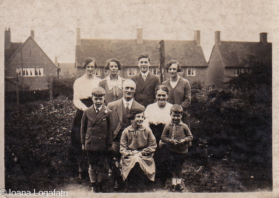Family gathering in a historic garden setting