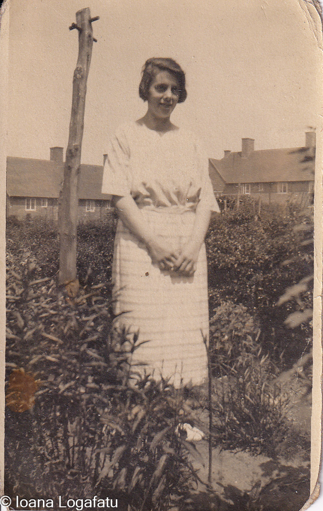 Young woman standing in a garden during summer