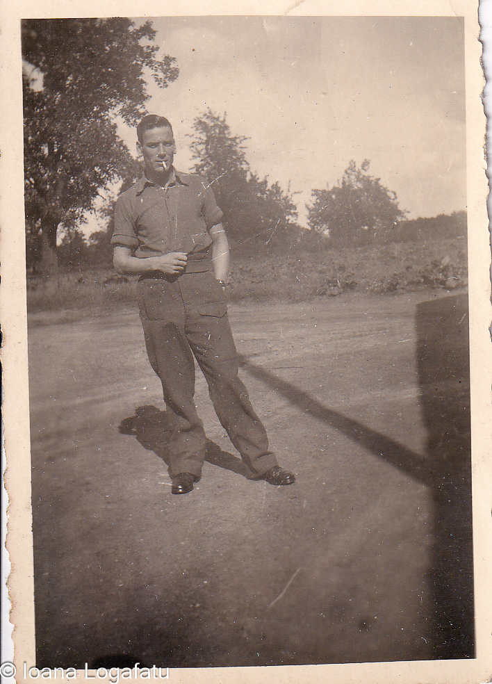 Stylish man standing in a sunlit clearing
