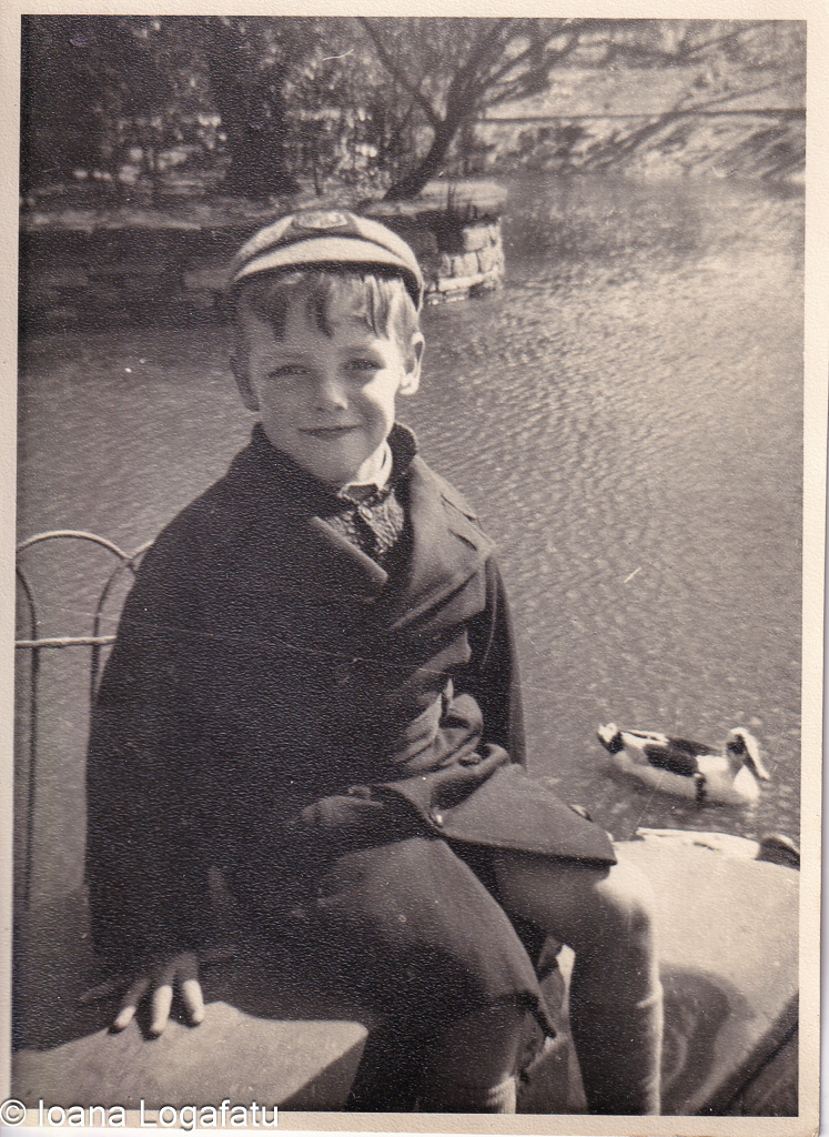 Smiling child by the serene pond in vintage attire