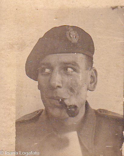 Serious soldier with a pipe enjoying a moment