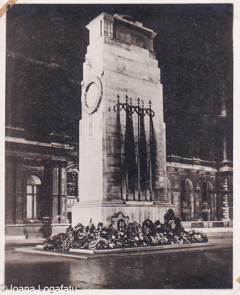 Floral tributes on night clock tower