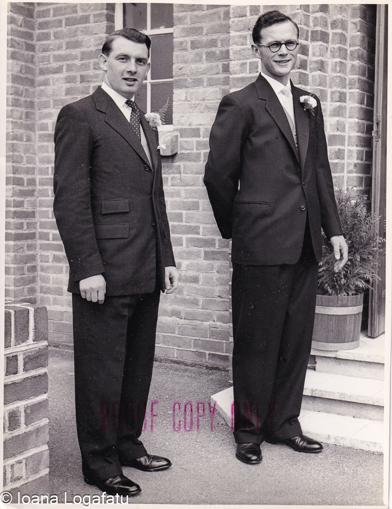 Stylish gentlemen pose together in classic suits