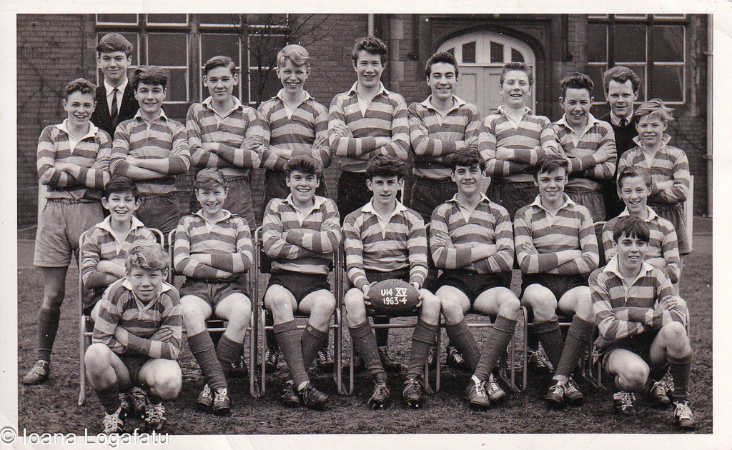 Young rugby players pose proudly at school field