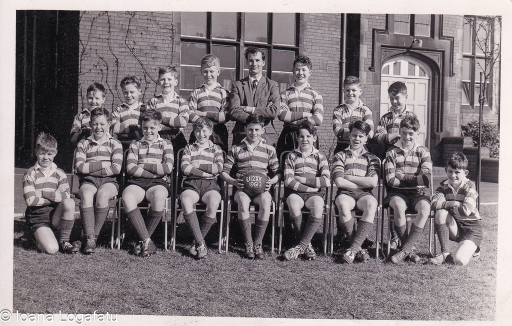 Young rugby team poses proudly at school in 1963