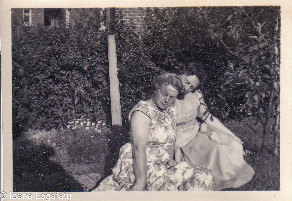 Two women enjoy a sunny garden moment together