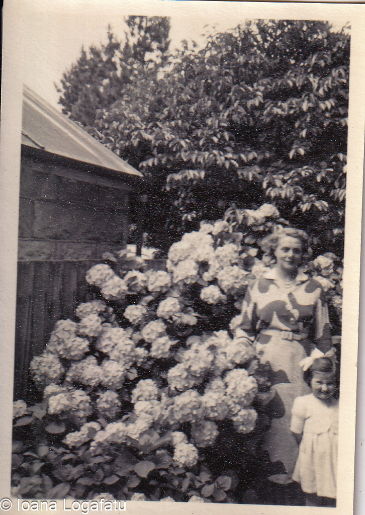 Woman and girl by spring hydrangeas