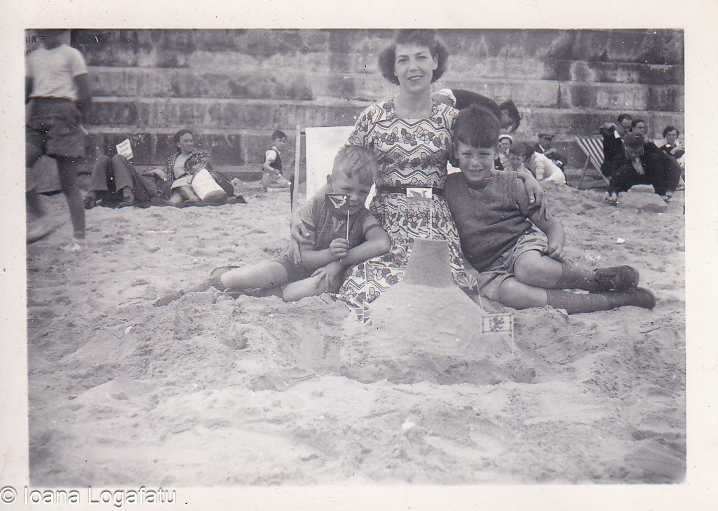 Family fun at the beach with sandcastle building