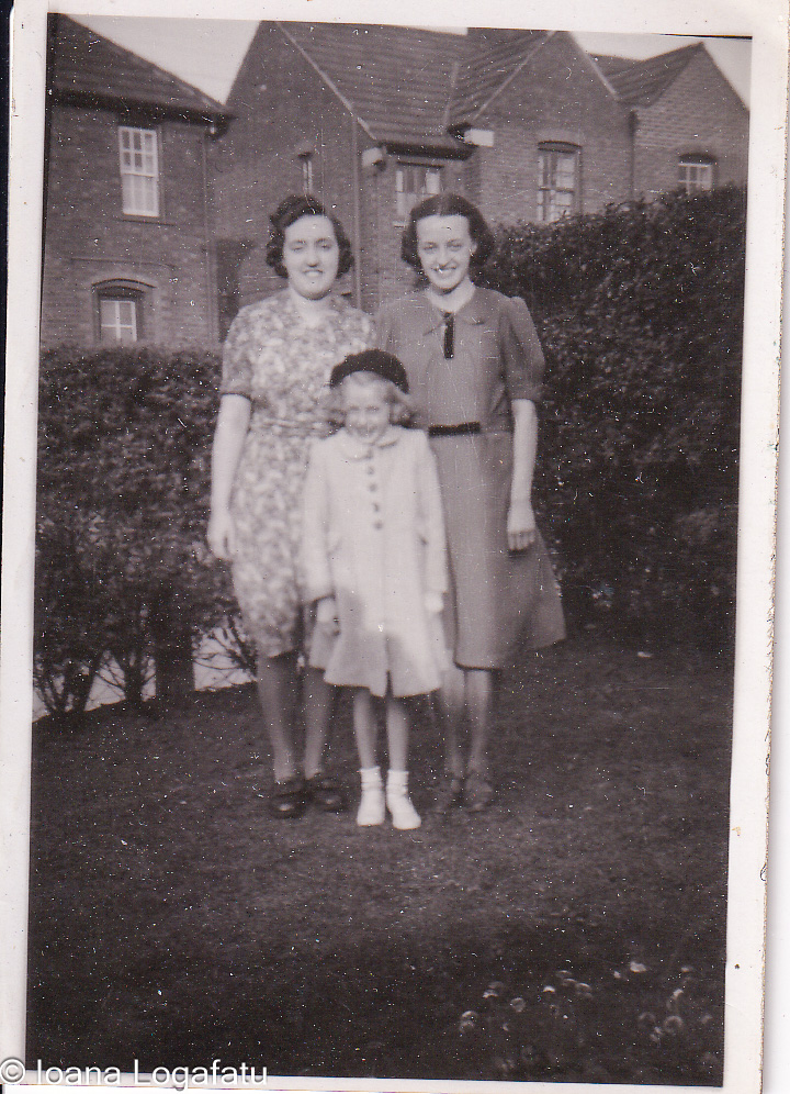 Three generations smiling in the sun
