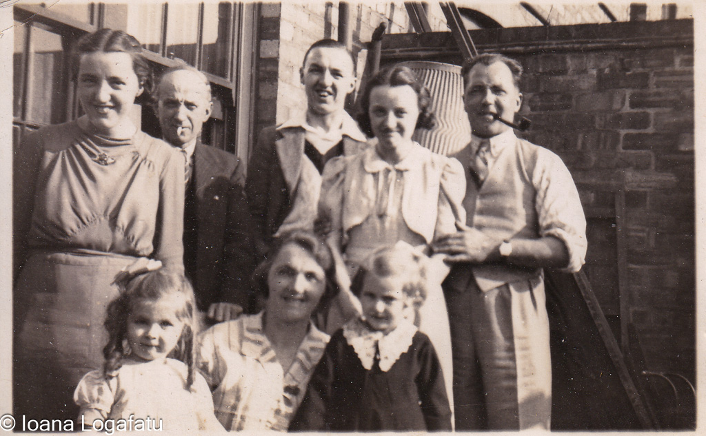 Family gathering in a sunny courtyard