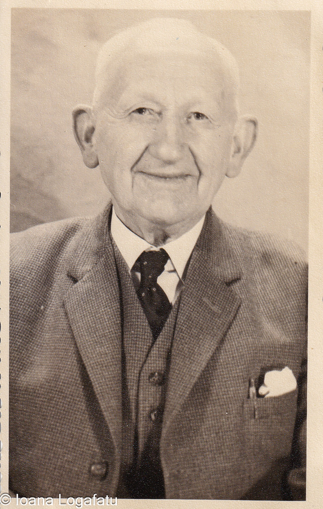 Elderly man smiling with gentle wisdom in his eyes