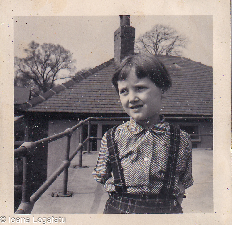 Young child enjoying a sunny day on the roof