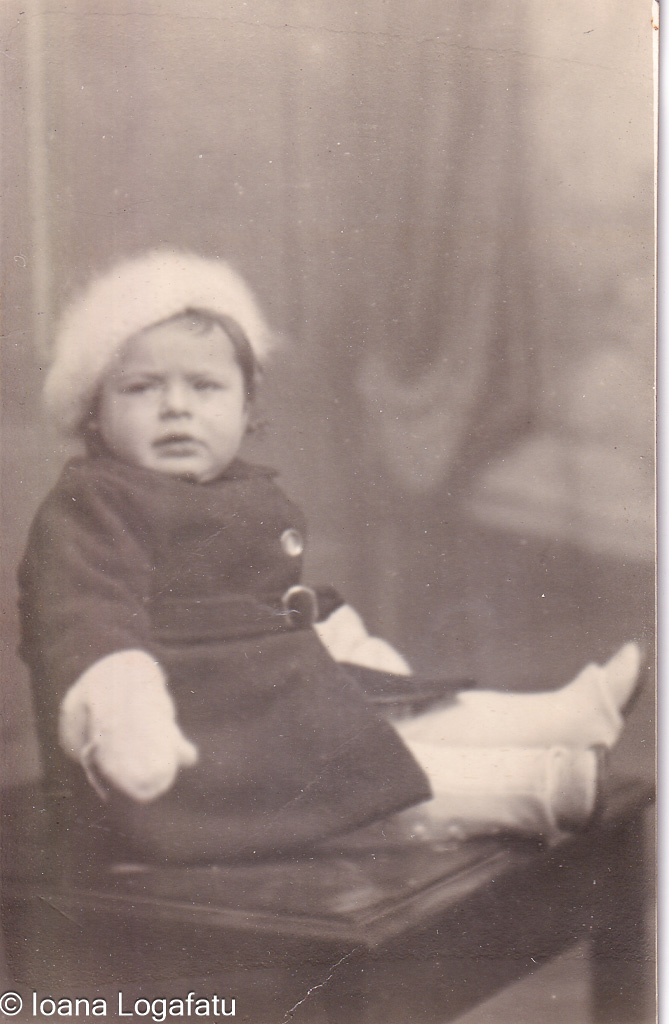 Charming child in vintage outfit seated