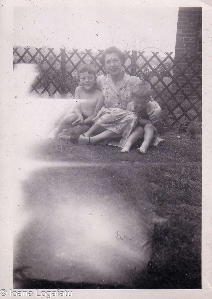 Mother and sons enjoying a sunny day in the yard