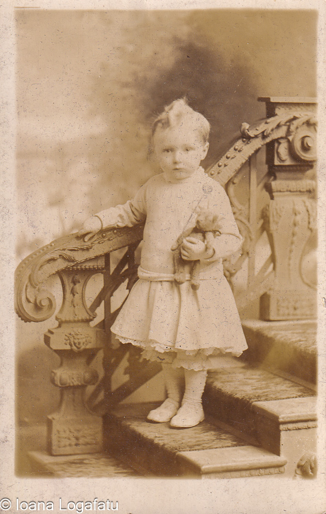 Girl in vintage dress on staircase