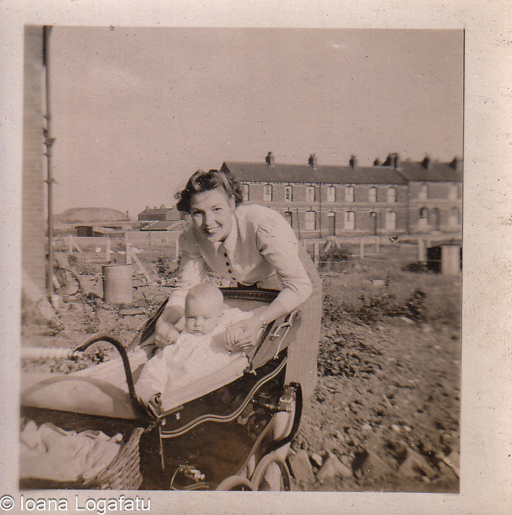 Joyful mother with baby in a sunny garden setting