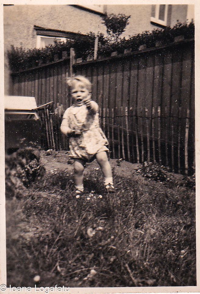 Child playing in a sunny garden full of joy