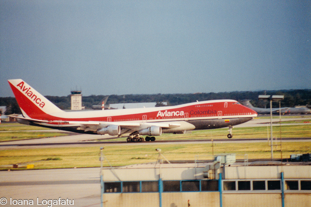 Historic aircraft landing at vibrant airport hub