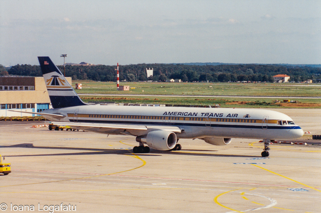 Vintage planes at busy airport terminal