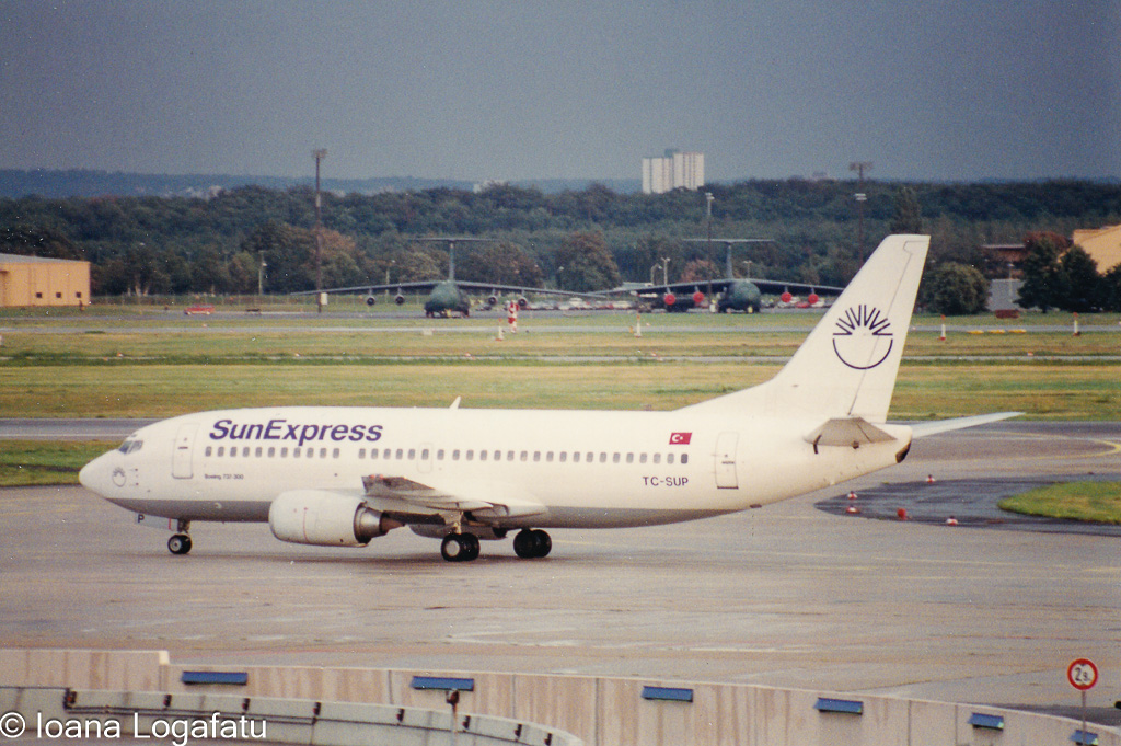 Airplane taxiing on a cloudy day at the airport