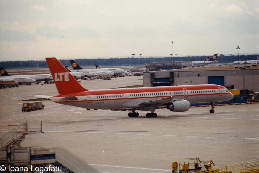 Vintage airplane taking off at the busy airport