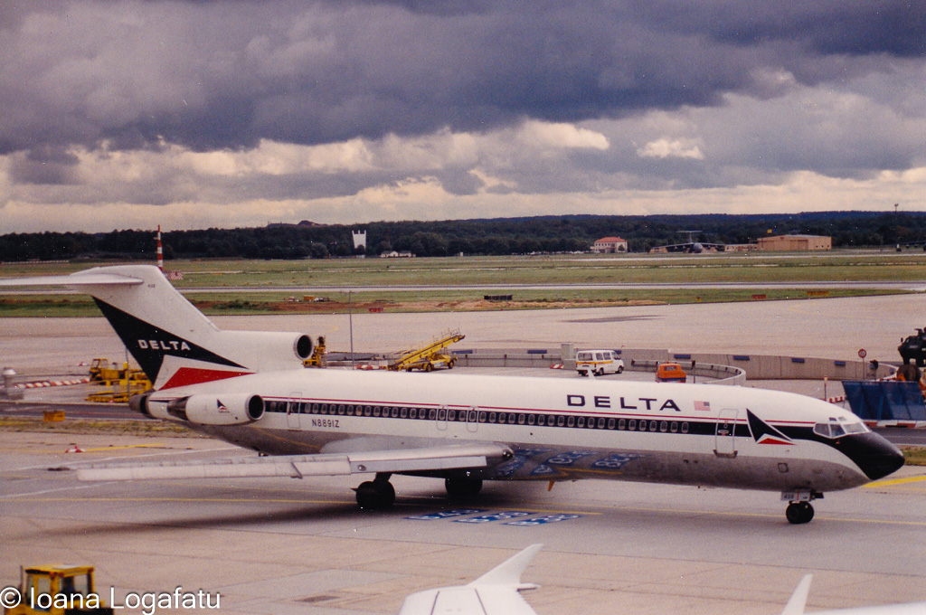 Classic aircraft gliding through a cloudy airport