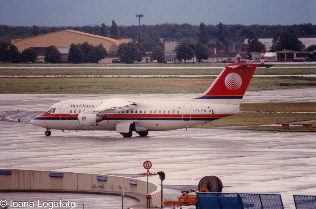 Vintage aircraft on a rainy runway in action