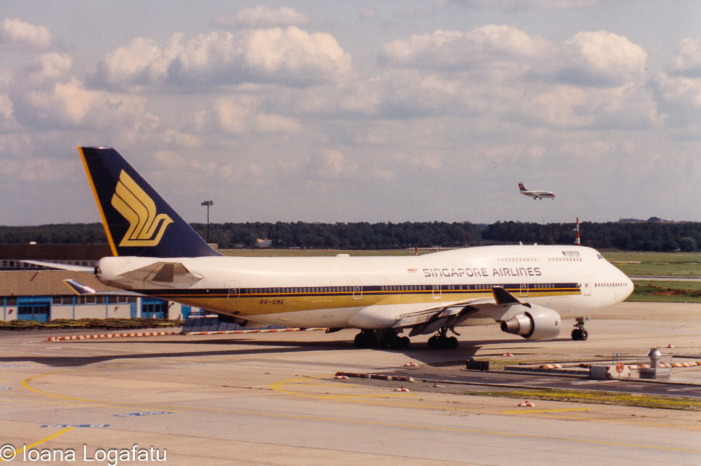 Vintage planes at a busy sunny airport