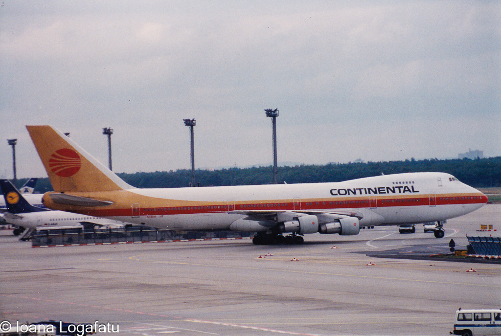 Vintage aircraft at bustling airport terminal