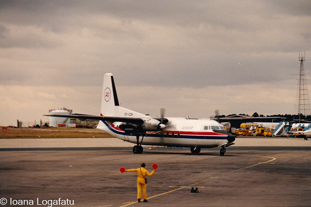 Airplane taxiing on a cloudy day at the airport