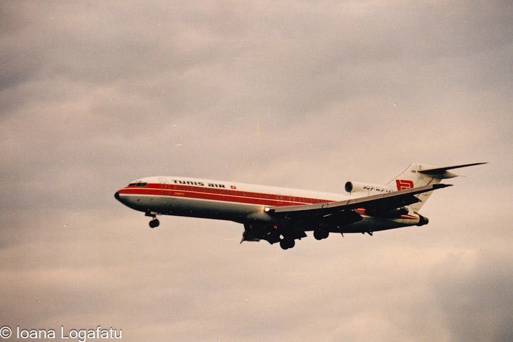 Airplane descends gracefully through cloudy skies
