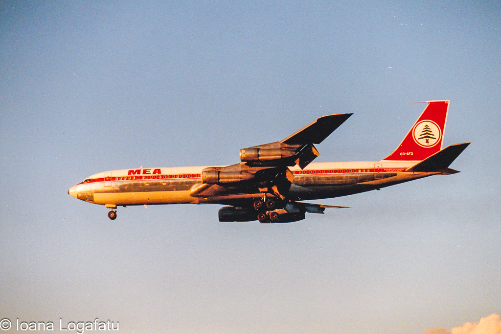 Classic jetliner soaring through a golden sunset
