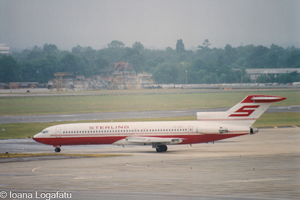 Vintage aircraft taking off in a cloudy sky