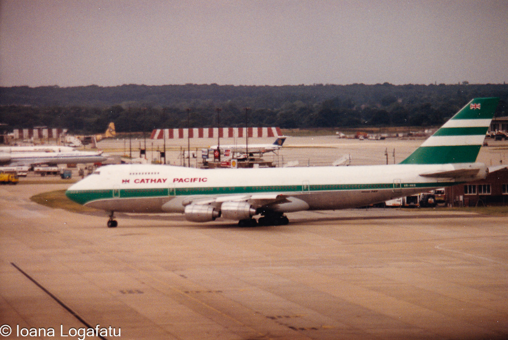 Vintage aircraft on the runway at a busy airport