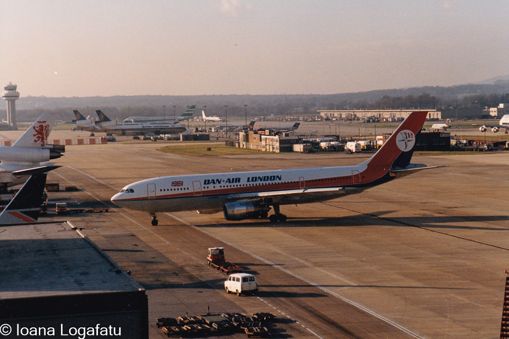 Vintage aircraft taxiing on a busy runway