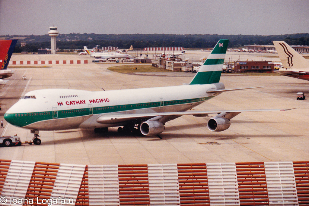Classic airliner at a busy airport during daylight